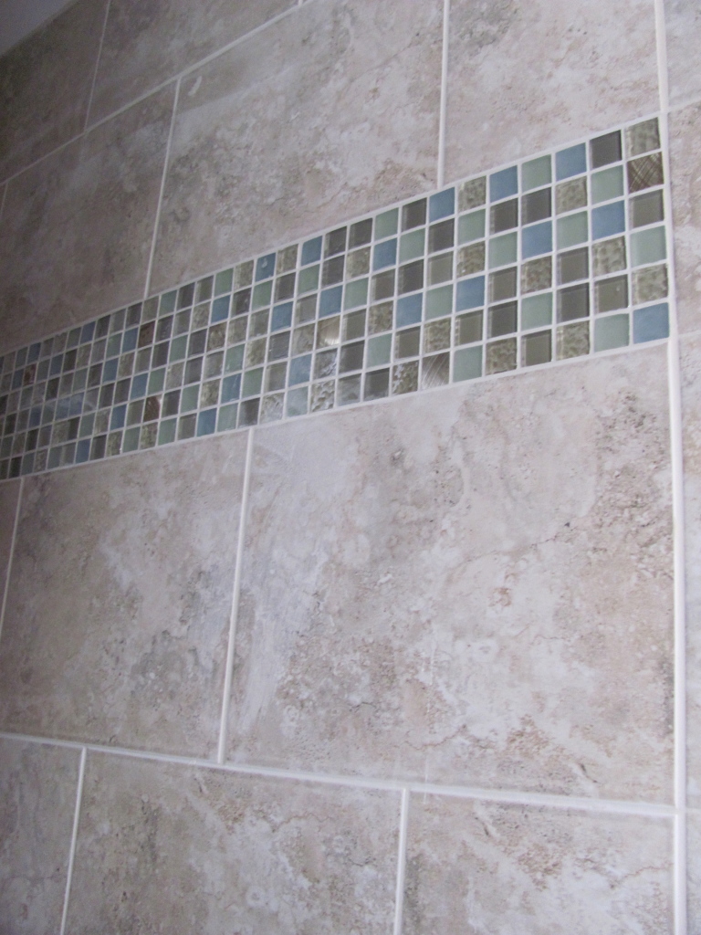 Glass mosaic add color & sparkle to the shower